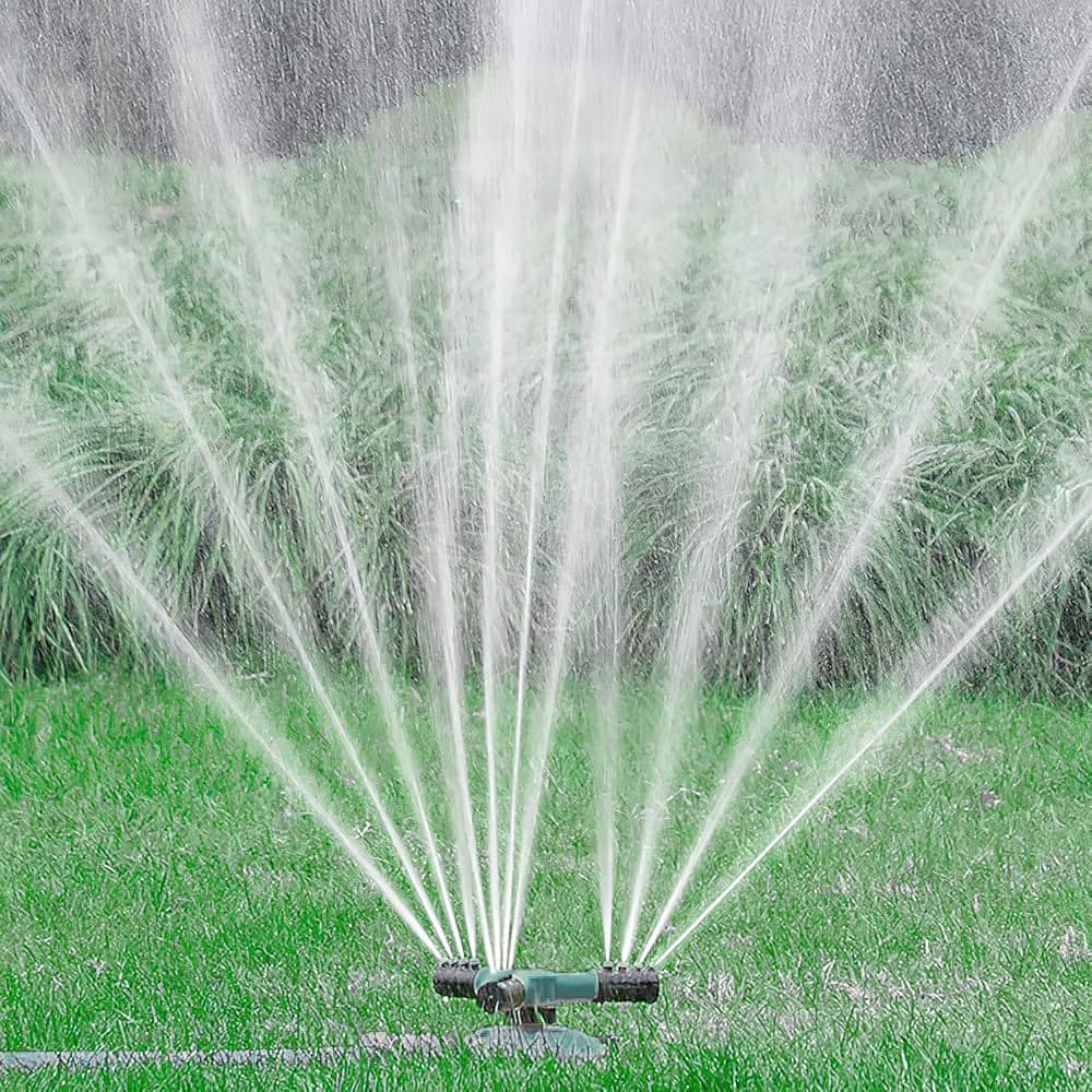 A technician adjusting sprinkler settings for efficient water use in a Utah County lawn during a reliable start up service, Irrigation professional calibrating sprinkler coverage and controller timing for even lawn watering